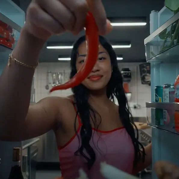 girl holding chilli pepper